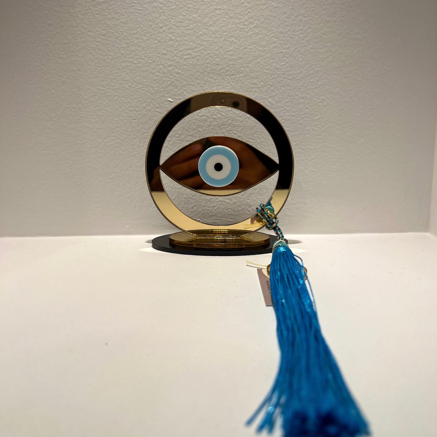 Gouri Gold Eye With Blue Tassel